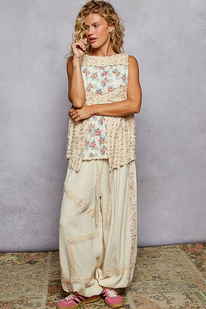 Round neck sleeveless textured woven floral top