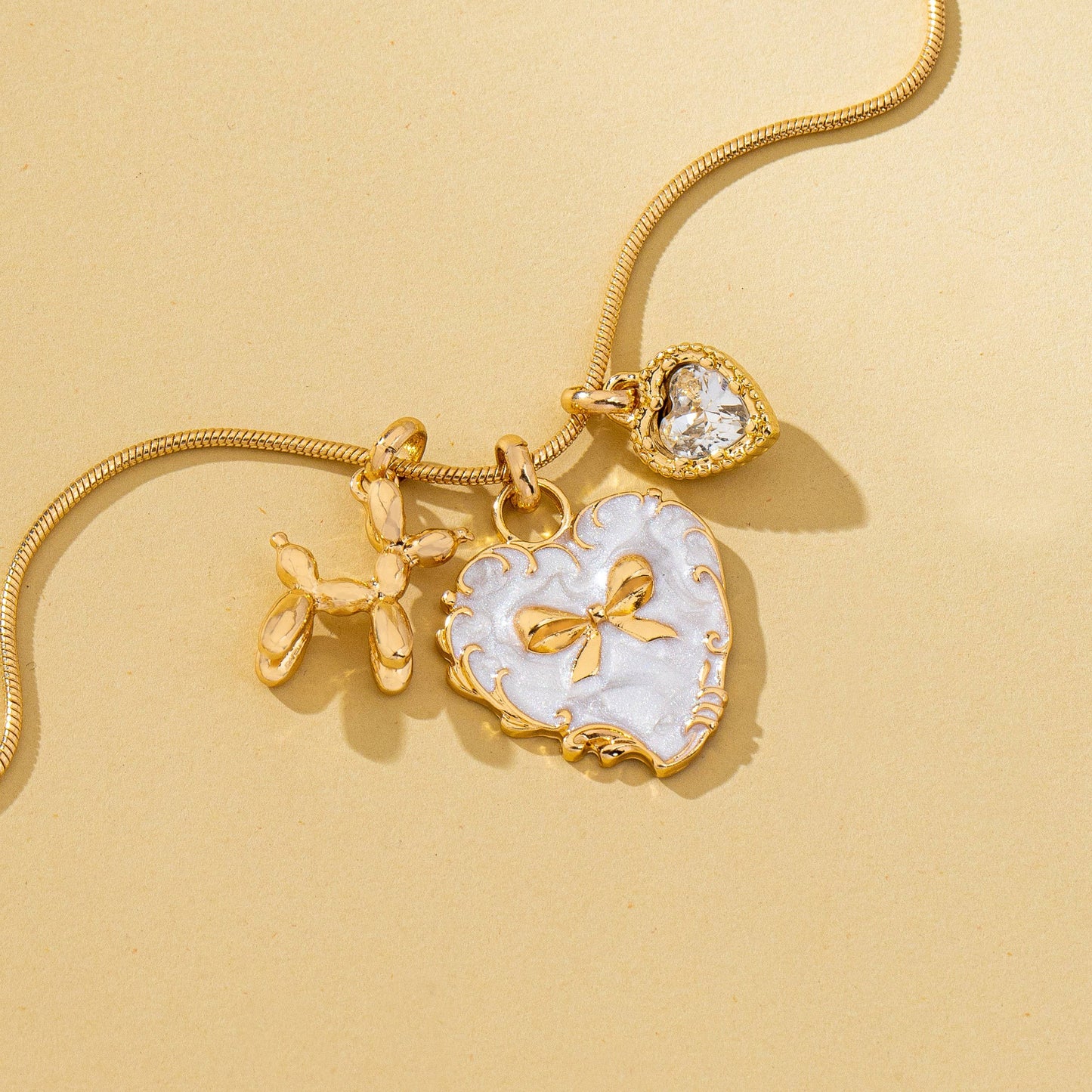 Bow Heart & Balloon Dog Crystal Charm Necklace | 80N93126