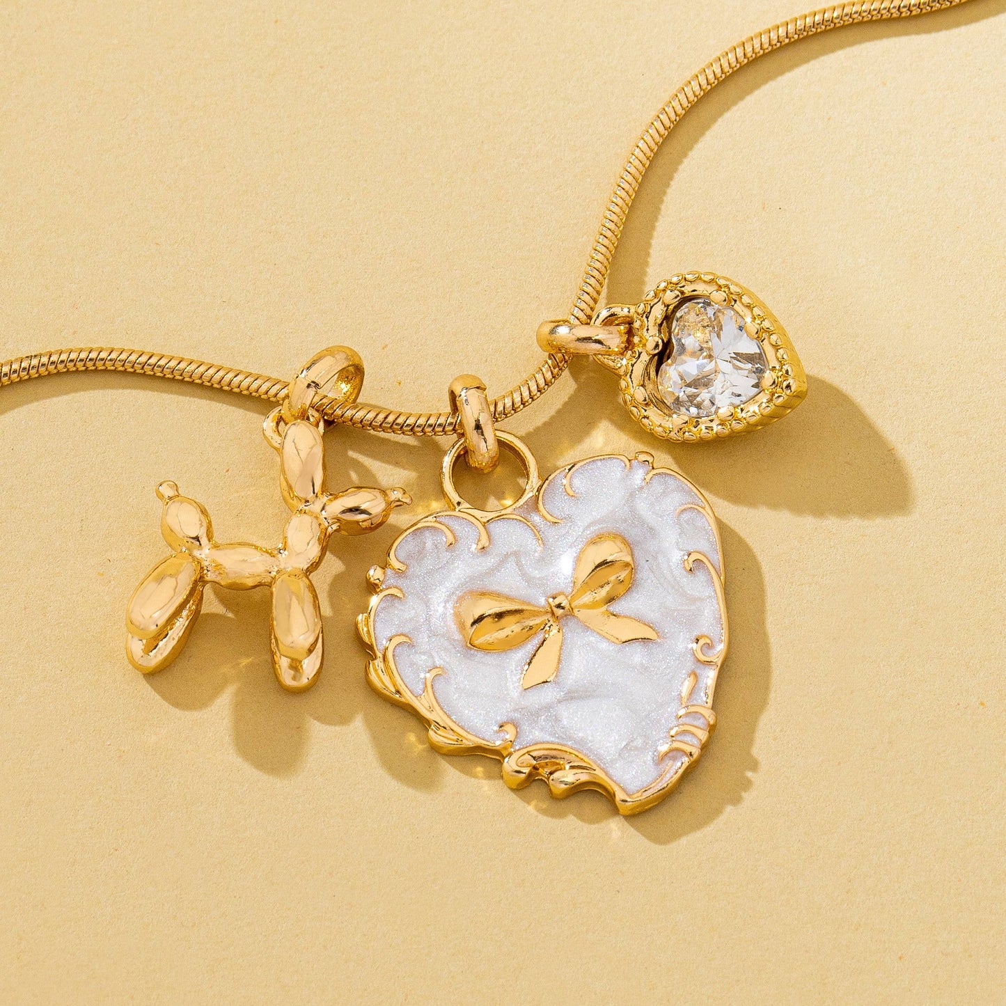 Bow Heart & Balloon Dog Crystal Charm Necklace | 80N93126